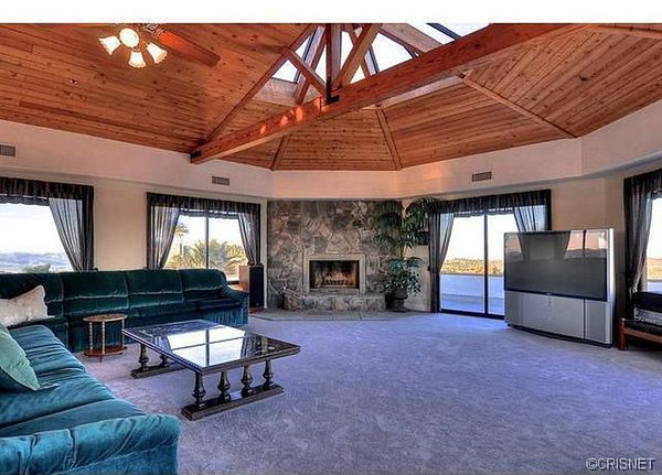 The house had an awkward octagonal footprint, outdated fixtures, and wall-to-wall carpeting in the living room.