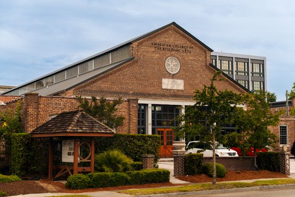 The American College of Building Arts, an unconventional accredited college in Charleston, South Carolina, is housed in the historic 1897 Trolley Barn. The building sat empty for many years until ACBA purchased it from the city in 2014.