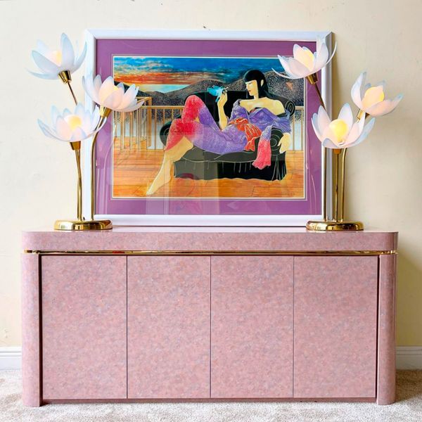 Laminate dressers and end tables make up a sizeable portion of Romano’s inventory, as do colorful prints and paintings and distinctive lamps.