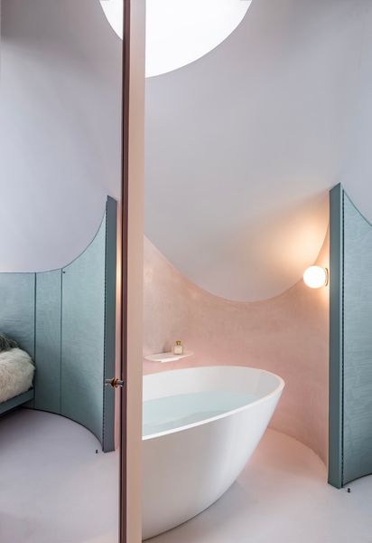 Placing a bathtub in a space with a less clearance allowed the team to put previously wasted square footage to use.