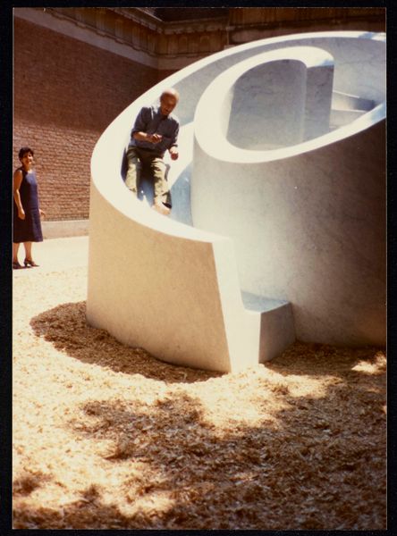Isamu Noguchi testing his <i>Slide Mantra as part of Isamu Noguchi: What is Sculpture?</i> at the 1986 Venice Biennale.