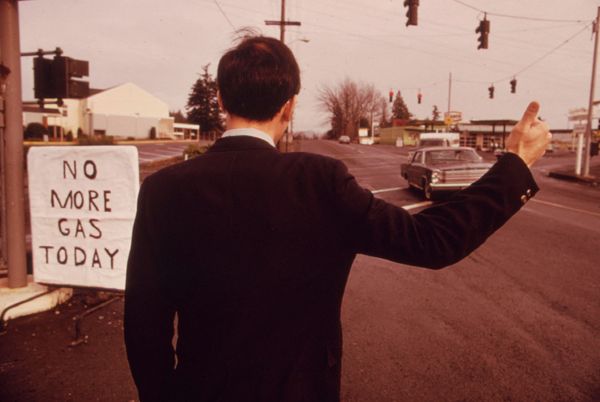 A businessman in Beaverton, Oregon, hitchhikes due to high gas prices in 1973.