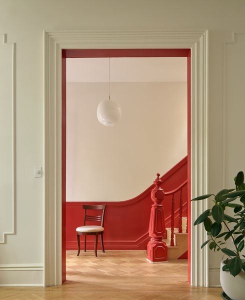 Architect Sarah Jacoby removed the ceiling tiles, brightened up the space with paint, and refinished the flooring.