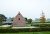 Wynants grew up sailing, and he created the piece to suggest "a moment of togetherness...the way one might gather at the back of the boat, to talk and drink." A side view of the house captures a glimpse of what he calls "the monolith." Photo 9 of Wynant House modern home