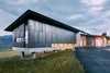 Modern home with Exterior, House Building Type, Shed RoofLine, Concrete Siding Material, Green Roof Material, and Metal Siding Material. Cor-Ten steel acts as the primary exterior material. Subtle design features in the steel paneling of the guest wing create notable results; every other panel is slightly offset to create visual and unexpected interest. Photo 2 of Wyoming Residence