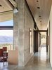 Modern home with Hallway and Concrete Floor. Once inside, natural light serves as an important material layered amongst its solid counterparts. Wood ceilings sit slightly pulled back from the walls to create a feeling of expansiveness. Photo 5 of Wyoming Residence