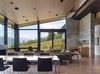 Modern home with Dining Room, Chair, Table, Recessed Lighting, Standard Layout Fireplace, and Concrete Floor. Floor-to-ceiling windows unveil a view of the stunning exterior scenery. Photo 6 of Wyoming Residence