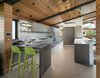 The minimal kitchen features a breakfast bar. Photo 6 of Cohen Residence modern home