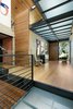 Translucent walkways keep an open concept feel. The client's art collection adds a playful touch. Photo 9 of Cohen Residence modern home