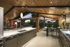 The upstairs living spaces cascade outside onto a terrace, which perfectly looks East into the famous Hollywood sign up in the mountain. Photo 15 of Cohen Residence modern home