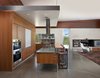 Inside, the datum line is seamlessly continued through the use of like materials, adding logic and structure to the design, and blurring the lines between inside and out. Photo 5 of Casper Residence modern home