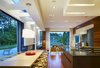 A minimal kitchen features Mid-Century furniture and lighting to create a welcoming family space. Photo 5 of Davis Residence modern home