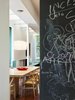 A chalkboard wall adds playfulness to the communal kitchen area. Photo 6 of Davis Residence modern home