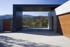 When first envisioning the home, the ATA design team was inspired by the homeowner’s profession - a commercial photographer. For this reason, they designed an architectural car port that frames the view of the mountains, an ideal setting for a car advertisement. Since its completion, the home has hosted commercial photo shoots for Lexus, Saab, Toyota and Chevy. It was also used as the set for the second season of Jonas Brother’s LA as well as in Katy Perry’s music video for her hit single “The One That Got Away”. Photo 3 of Lima Residence modern home