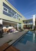 The division between the solid and transparent wings of the structure are clearly visible from the patio. Photo 9 of Goodman Residence modern home