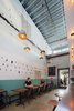 The interiors of the repurposed car bays show their industrial background. This taco bar, also designed by Abramson Teiger Architects, has raw cinder block on the walls leftover from its car repair roots. Photo 7 of PLATFORM modern home