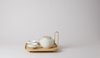 The product, produced by centuries-old Japanese porcelain maker Kihara Ceramics, includes a pot, strainer, and two bowls. (The Sucabaruca tray, also by the two designers, is pictured with the set.) Photo of Coffee and Tea Seen Through Designers' Eyes modern home