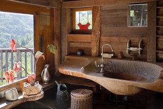 J.B. Blunk’s first real masterpiece was his own home he built in Inverness, California. He hand-carved intricate details throughout the home, where it fit harmoniously with its natural surroundings. We learned that he would often find a tree he admired in his backyard and turn it into a sculpture without removing it from the ground. Shown here is his sink he carved by hand with a chainsaw and chisel, his chosen tools of the trade. Photo by Kodiak Greenwood, courtesy of Reform Gallery. 