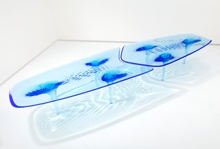 Zaha Hadid’s Liquid Glacial dining table and chair are crafted with acrylic that’s been manipulated to look like suspended pieces of formed ice. 