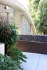 Modern home with Outdoor, Concrete Patio, Porch, Deck, and Small Patio, Porch, Deck. One of the most iconic elements of the home is the lava rock that was brought over from Hawaii. It still stands as one of the main structural elements. Photo 4 of The Garcia House