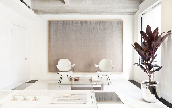 Shown here is the lounge/waiting area where customers can make themselves comfortable when they first enter. Early Work’s co-founder and artist Mimi Jung created the woven artwork that watches over the space.