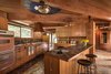 In the kitchen, the mother of pearl light fixture—which was installed by the Little family in the 1970s—is surrounded by three concentric rings of dark blue tiles from Sausalito-based Heath Ceramics. Liebermann actually installed Heath tiles in the kitchen, baths, pool, and fountain. Photo 11 of Liebermann House modern home
