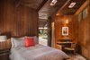 Connected by the same room but 20 yards away from the main house, sits the pool or guest house, which has one bedroom and one bathroom. Liebermann built the small round desk shown here, which sits under original porthole skylights. Photo 12 of Liebermann House modern home
