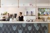 Modern home with Dining Room, Bar, and Pendant Lighting. Immediately when you walk in, Olive & Oliver catches your eye on the left. Founded by husband-and-wife team, Ali McMahon and Parker Moosman, the boutique that accompanies the coffee shop boasts a curated collection of fashion and home goods that are inspired by iconic surf culture. Photo 10 of The Surfjack Hotel & Swim Club
