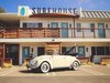 Modern home with Exterior and Apartment Building Type. During the process, they added upper and lower decks for visitors to enjoy, and inset sea glass into part of the concrete walkways in order to make visitors feel like they’re still at the beach. Photo 3 of Surfhouse Boutique Motel