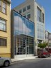 The smooth glass street façade de-materializes the dense urban fabric, creating a shimmering void reflecting the sky by day and a glowing interior by night - seamlessly integrating vehicular and pedestrian “drive through” access from Minna Street to the rear yard.
#sanfrancisco #workshop #interstice #intersticearchitects #cesarrubio #cesarrubiophotography #facade Photo 5 of Minna Street DREAM:shop modern home