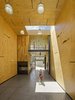 The empty Horizontal Tube is a “smart structure” integrating an electric radiant floor slab and panelized plywood walls and ceilings. Prefabricated walls conceal a myriad of high performance systems including acoustical absorption, vascularized supply lines, and muti-layered plug-ins. The volume is organized around a second smaller Vertical Tube that extends 28 ft. from floor to ceiling as a three level service core clad in reclaimed myrtle wood.
#interior #interiorarchitecture #sanfrancisco #workshop #interstice #intersticearchitects #cesarrubio #cesarrubiophotography Photo 4 of Minna Street DREAM:shop modern home