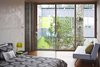 The minimal bedroom reflects the raw material palette of glass, concrete, wood, and Corten steel. This bedroom has a view to the separate volume, and to a large Douglas fir between the two spaces.
#bedroom #nature #residential #interstice #intersticearchitects #bradlaughton #bradlaughtonphotography Photo 19 of TreeHugger modern home