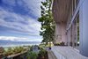The main house is clad in the local Douglas fir with deep protective eaves, stained grey to match the sun-bleached drift wood logs that litter the coast.
#facade #residential #residentialarchitecture #coastline #beachhouse #beachhouses #view #porch #beachfront #britishcolumbia #vancouverislands #bradlaughton #bradlaughtonphotography Photo 10 of TreeHugger modern home