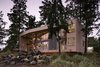 The geometric dwelling acts as two organically interconnected frames, one mineral and one of wood which float above a virtually undisturbed site between one of the world’s richest marine tidal ecosystems to the northeast and a wetland preserve to the southwest. The extremely limited lot was dominated by a traversing grove of 350-year-old Douglas fir trees into which the home was surgically inserted in order to share their shelter which provides essential habitat for bald eagles and a host of other wildlife.
#wildlife #architecture #facade #trees #beachhouses #beachhouse #interstice #intersticearchitects #bradlaughton #bradlaughtonphotography #britishcolumbia #vancouverisland #residential #residentialarchitecture Photo 2 of TreeHugger modern home