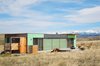 Shipping Container Home
Livingston, MT, United States
Welcome to the “Little Box on the Prairie”. This unique, modern house is made from two recycled shipping containers, situated on 10-acres of rolling prairie, just North of Livingston Montana. It’s a 700 square-foot mix of rustic coziness and clean, modern design. Many of the finishes such as the redwood flooring and plywood wall panels were salvaged off site, recycled and reused. The outside deck is perfect for chatting over morning coffee, an evening glass of wine, gazing at the Absaroka Mountains and likely spotting a deer or antelope. The house comfortably sleeps 2, and a 3rd can sleep on the sofa if needed.
https://www.airbnb.com/rooms/3292920 Photo of 20 Ideas On What You Can Do With Old Shipping Containers modern home