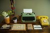 Modern home with Office and Desk. A working vintage typewriter and telephone top the antique desk. Photo 6 of Graduate Madison