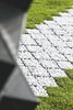 A pebble path echoes the patterns of the printed cells and the concrete that fills them.
Photo: Sophia van den Hoek Photo of Book a Stay in This 3D-Printed Tiny House modern home