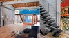 Stacked containers with custom steel stairs provide access to upper container and roof deck Photo of Wardell Sagan Residence modern home