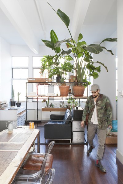 The apartment’s centerpiece is a dining table made from wood reclaimed from a variety of projects.