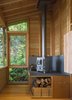 Modern home with Shed & Studio, Living Space Room Type, and Den Room Type. While the space is heavily insulated, with strong solar gain, a cast-iron stove from Salamander Stoves provides extra warmth on cool days. Photo 5 of Cutler Studio/Bunkhouse