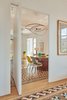 Modern home with Hallway, Light Hardwood Floor, and Ceramic Tile Floor. Photo courtesy of Built Architecture Photo of Eames Molded Chairs