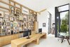 Modern home with Office, Bookcase, Shelves, Light Hardwood Floor, Study Room Type, and Storage. Sunken double height office Photo 6 of Lipan House