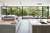 Modern home with Living Room and Recessed Lighting. Kitchen and living room with operable window wall Photo 11 of Lipan House