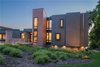 Modern home with Outdoor, Shrubs, Front Yard, and Grass. Photo courtesy of Holmes, King, Kallquist & Associates provided by Marvin Windows and Doors; project submitted to 2017 Marvin Architects Challenge Photo 4 of Modern Waterfront Residence