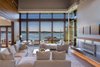 Modern home with Living Room, Sectional, Chair, and Ceiling Lighting. Photo courtesy of Holmes, King, Kallquist & Associates provided by Marvin Windows and Doors; project submitted to 2017 Marvin Architects Challenge Photo 7 of Modern Waterfront Residence