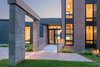 Modern home with Outdoor, Front Yard, Grass, and Shrubs. Photo courtesy of Holmes, King, Kallquist & Associates provided by Marvin Windows and Doors; project submitted to 2017 Marvin Architects Challenge Photo of Modern Waterfront Residence
