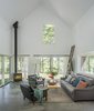 Modern home with Living Room, Corner Fireplace, Sofa, Chair, Floor Lighting, and Coffee Tables. Architect Elizabeth Herrmann’s Knoll House project, Best Transitional category winner of 2017 Marvin Architects Challenge.
Photo 4 of Knoll House