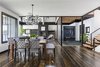 Modern home with Dining Room, Bench, Ceiling Lighting, Chair, and Table. Photo courtesy of Rehkamp Larson Architects provided by Marvin Windows and Doors Photo 3 of Lake Edge
