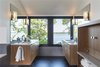 Modern home with Bath Room, Engineered Quartz Counter, Undermount Sink, Cement Tile Floor, and Wall Lighting. Photo courtesy of Rehkamp Larson Architects provided by Marvin Windows and Doors Photo 9 of Lake Edge
