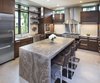 Modern home with Kitchen, Wood Cabinet, Ceiling Lighting, Pendant Lighting, Refrigerator, Dishwasher, Range Hood, and Range. Builder John Kraemer & Sons’ Lake Calhoun Organic Modern residence, winner of 2016 Integrity Red Diamond Achiever Award Photo 3 of Lake Calhoun Organic Modern